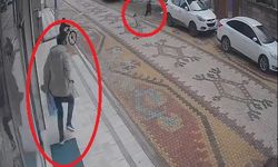 Esnafın, çocuğu, sokak köpeğinin saldırısından kurtardığı anlar kamerada